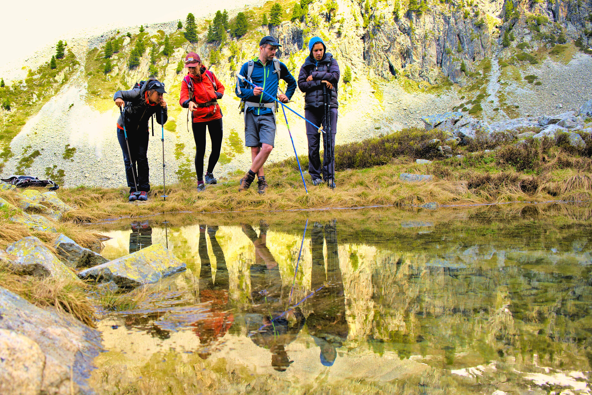 Hikers stopped by a mountain lake